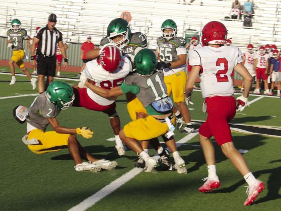 A host of Lions surround and bring down a Hico Tiger Thursday, Aug. 20 to stop the ball. Paul Gaudette | Citizen staff photo