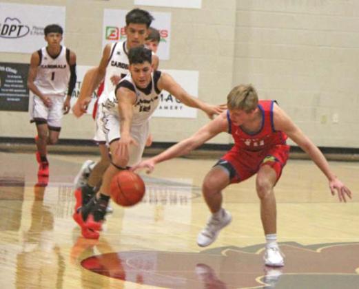 Lingleville Cardinals wrestle control of the ball during a recent home game. Paul Gaudette | Citizen staff photo