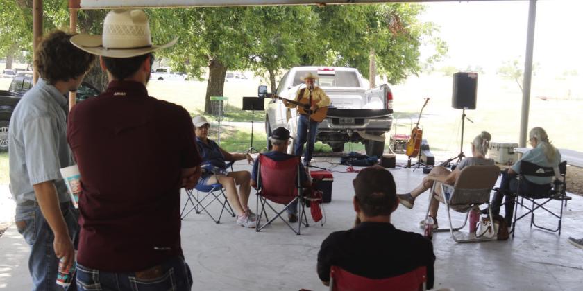 Tim Turnbeaugh (above) and Zack Foster (below) play some cowboy favorites at the park. The Dublin Renegades had fans, coolers and water at the ready as they hosted a cooling station. Paul Gaudette | Citizen staff photo