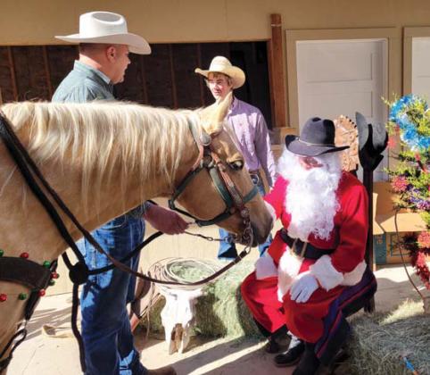 There were no long faces as Desdemona, an equine believer, met Cowboy Santa, Saturday, Dec. 2 at the Cowboy Christmas event hosted by Lily G in conjunction with Toys for Tots and Revitalize Dublin. Wyndi Veigel-Gaudette | Citizen staff photo