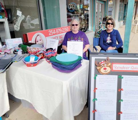 Vendors set up downtown in lieu of a December Market Days event in Wright Park in order to bring more people shopping into downtown businesses for the holiday season. Wyndi Veigel-Gaudette | Citizen staff photo