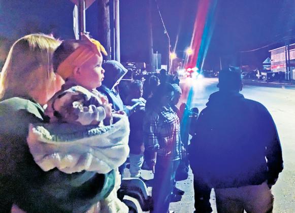 A baby enjoys her first Christmas parade in downtown Dublin. Paul Gaudette | Citizen staff photo