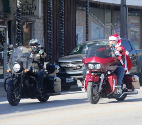 A Santa helper on a bike leads the 2023 Toy Ride through downtown Dublin Saturday, Dec. 2. Servant Souls along with many others helped collect toys for the Double N Cowboy Church’s Angel Tree. Wyndi Veigel-Gaudette | Citizen staff photo