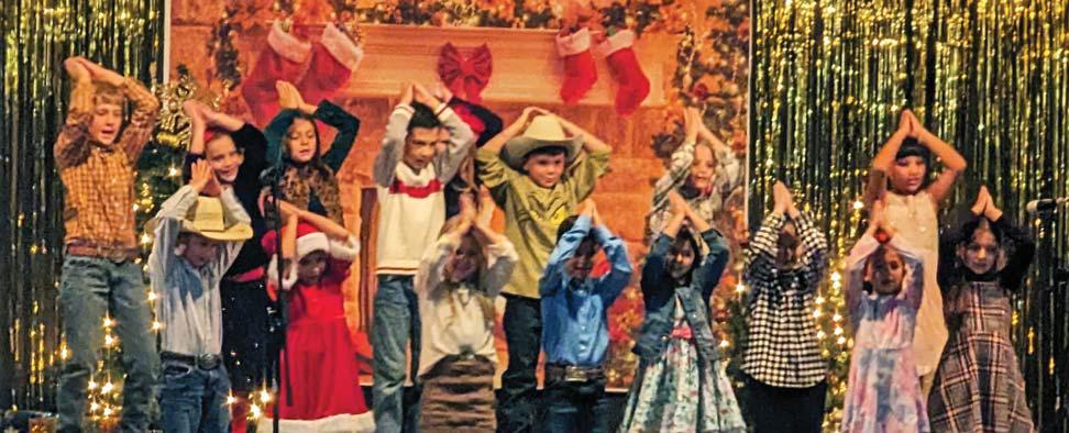 Paul Gaudette | Citizen staff photo Elementary aged kids perform at the Lingleville ISD Christmas program singing a rendition of Santa Shark, complete with hand motions in the performance.