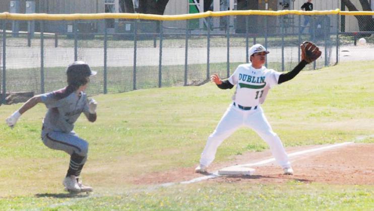 Dublin Lion Jonathan Campos reaches out to catch a ball at third base as a Millsap runner attempts to flee to home plate. Paul Gaudette | Citizen staff photo