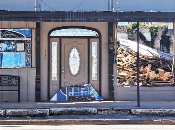 The roof of the building next to the Corner Lot collapsed last week leaving a pile of rubble for the owners to sort through and a demolition permit to remove the debris has been applied for. Paul Gaudette | Citizen staff photo