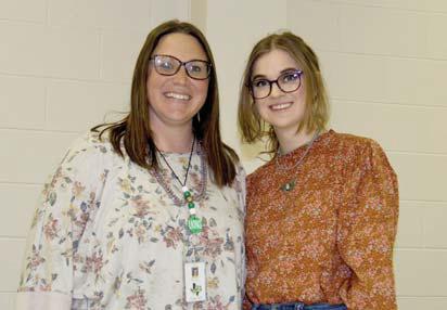 Junior High School Teacher of the Month Principal Paige Johnson presents Kaley Herms with Teacher of the Month.