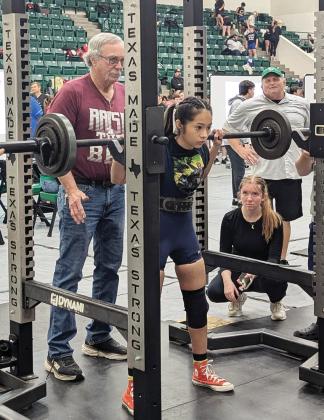 Dublin Lifter Samantha Marinez is watched over by coaches at the Dublin invitaional powerlifting meet Saturday, Jan. 18 where she took second in her class. At right, Cassidy Adair (spotted by her brother, Roger) took first in her class while Alonso Moreno took second in his division. Paul Gaudette | Citizen staff photo