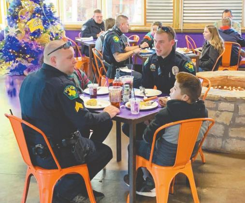 Dublin officers and other local law enforcement shared a special breakfast with 40 Erath County children at The Purple Goat Monday before taking them on a special shopping trip as part of the inaugural Shop with a Cop event. Cameron Ray | submitted photo