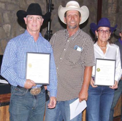 Jim Sharp, left, and JJ Hampton, right, were inducted into the Living Legends for the Dublin Rodeo Heritage Museum. Hampton also received awards on behalf of her mom, dad and brother. Organizer and Board member Rick Taylor presented the awards. Paul Gaudette | Citizen staff photo