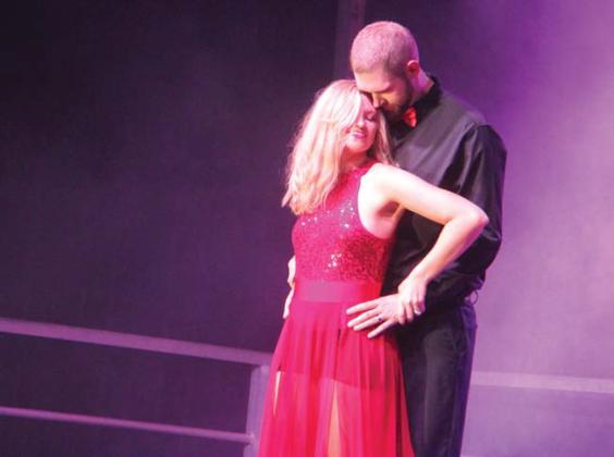 Shani exchanges an embrace with her dance partner and husband Marcus Taylor for a dance number to “Top Gun’s” hit song, “Take My Breath Away” by Berlin. Below, Kimberly and Ben Dunnahoo perform to a Top Gun song. Wyndi Veigel-Gaudette | Citizen staff photos