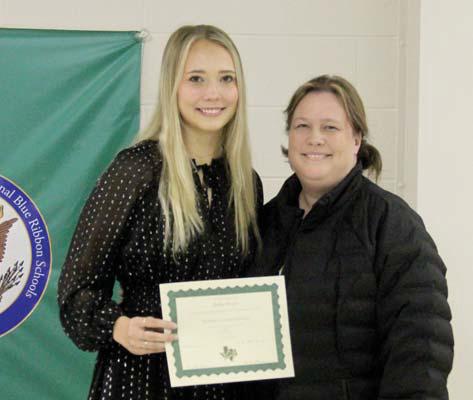 Extracurricular Scholar Bailey Watson. Presented by Cheer sponsor and her mom, Christine Watson.
