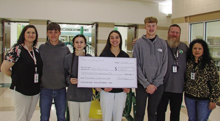 Four DHS seniors were awarded third place and $1,500 in scholarships to split as part of the Texas Midwest Community Network Leadership contest for constructing, installing and stocking raised flowerbeds near the Dublin City Park sign. Pictured are advisor Regina Rasberry, Tatum Babkowski, Emma Mitchell, Olivia Salyer, Hayden Milburn, advisor Shawn Bradford and Secondary School principal Dr. Norma Villicana- Arreguin. Paul Gaudette | Citizen staff photo