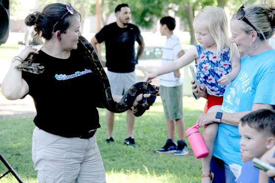 Kids and adults of all ages learn that snakes are, in fact, not slimy as they stroke Thor, a Boa Constrictor from South America. Wyndi Veigel-Gaudette | Citizen staff photo