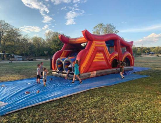 Kids of all ages enjoy a bounce house during the block party hosted by the Church for The Lost &amp;amp; Found - Dublin First Assembly. Submitted photo