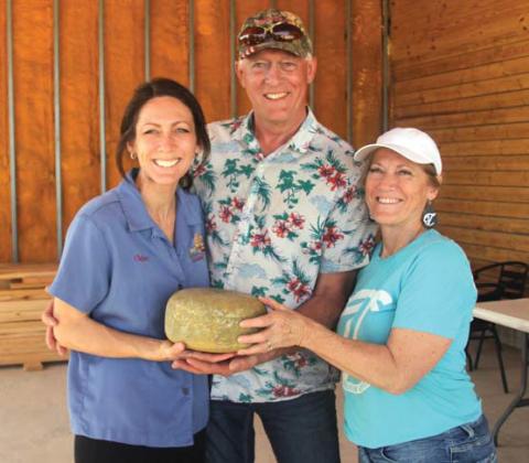 Stuart, Connie and Chelsea Veldhuizen show off ‘Ashes of my Ex,’ a new cheese at Veldhuizen Cheese Farm. Wyndi Veigel-Gaudette | Citizen staff photo