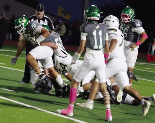 Dublin Lion Joe Salinas keeps pushing as a Comanche Indian tries to bring him to the turf in the Friday, Oct. 16 home game. Paul Gaudette | Citizen staff photo