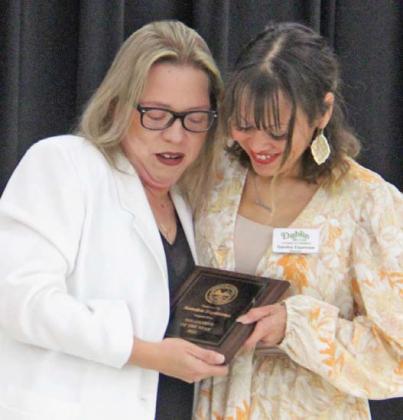 Sandra Espinosa is presented this year’s Volunteer of the Year award by Juanita Torres on behalf of the Dublin Chamber of Commerce. Wyndi Veigel | Citizen staff photo