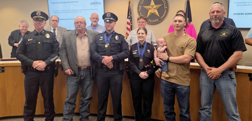 Stephenville K-9 Officer Colby Stone and Erath County Deputy Taylor Tully were presented with a lifesaving award by the Stephenville PD and ECSO for helping to save a stabbing victim. They were presented the awards Tuesday, May 6 by Police Chief Dan Harris, Sheriff Matt Coates and their families. Wyndi Veigel-Gaudette | Citizen staff photo