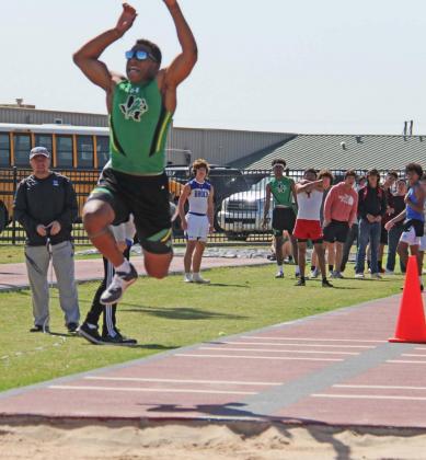 Tyler Harrell (seen here in the Triple Jump) broke the school record in the long jump on April 13 with his first place finish at the District track meet in Dublin. Paul Gaudette | Citizen staff photo