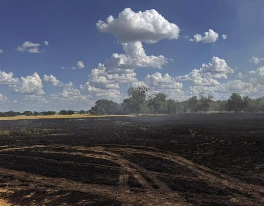 Departments battle grass fire on CR 343