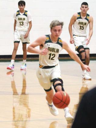 Dublin Lions Carson Ivie, Alex Teten and Aidan Herandez advance the ball down the court in a recent home game. Paul Gaudette | Citizen staff photo