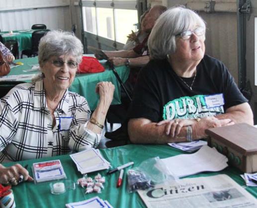 Volunteers help check in former graduates from DHS during the all class reunion. Paul Gaudette | Citizen staff photo