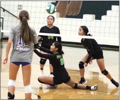 Dublin JV Lady Lions go low to return a ball against Peaster in a home game Saturday morning. Although hard-fought, both Dublin JV teams fell to the opponents. Paul Gaudette | Citizen staff photo