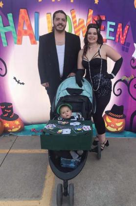 Alexander Rodriguez plays the starring role in Casino by dealing cards while being escorted by his supporting cast members, otherwise known as his mom Raven Laughlin and his dad Dylan Rodriguez. They received second place in the group division. Submitted photo