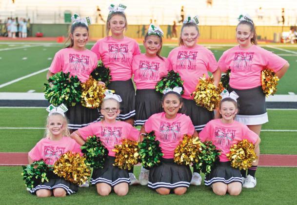 Mini Cheerleaders and Dandi-Lions were on the field showing support for the Dublin Lions and breast cancer research with pink shirts for the pink out game Oct. 11. Below, Francisco Garcia runs the ball past Brady defense with teammates running behind to help. Danielle Meador | Citizen staff photos