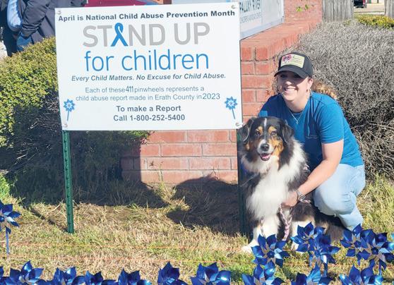 Police Chief Cameron Ray plants pinwheels at Paluxy River Children’s Advocacy Center in honor of April’s Child Abuse Awareness Month. Below, Lyndi Hanna with Annie’s Therapeutic Companions along with her therapy dog Annie, were part of the Child Abuse Prevention event. Wyndi Veigel-Gaudette | Citizen staff photo