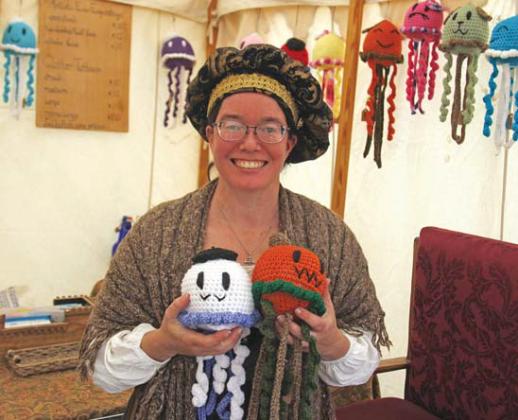 Jenn Saucier displays handmade jellyfish that can be squeezed for stress relief that are for sell at the faire. Paul Gaudette | Citizen staff photo