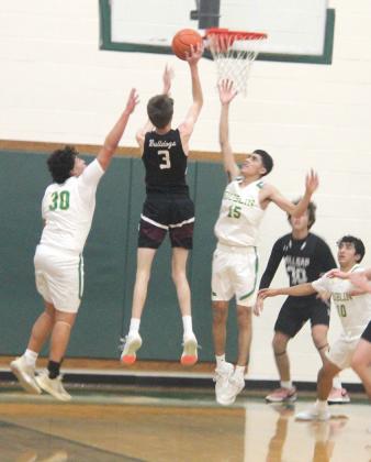 Dublin Lions leap to shoot and block at the Feb. 11 home game against Millsap which resulted om 74-66 Dublin win and a third place finish in district. Paul Gaudette | Citizen staff photos
