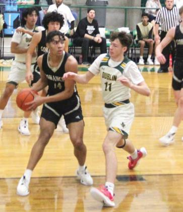 Dublin Lions Kyson Gilman and Frincisco Garcia fight Comanche for the ball during the Feb. 2 home game. Paul Gaudette | Citizen staff photo