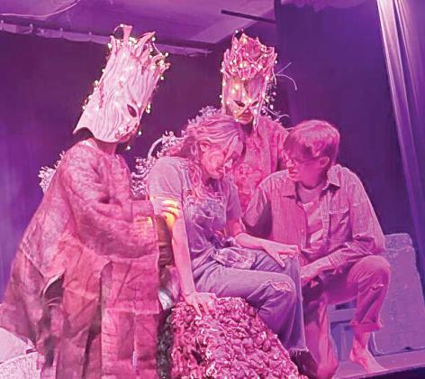 Firefly trees surround Josephine and her ‘brother’ Don as Josphine’s character is overwhelmed by anxiety. Courtesy photo