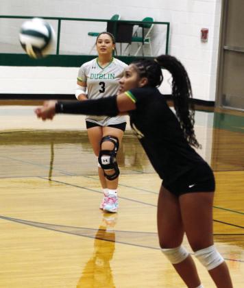 Dublin Lady Lion Savannah Chacon (above) leaps to return the ball against Hamilton while Adriana Stewart bumps the ball back as teammate Haden Keilers looks on. Paul Gaudette | Citizen staff photos