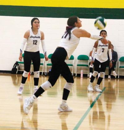 Lingleville Lady Cardinal Brynlee James returns the ball as teammates Denise Toledo and Jazmin Martinez watch during the opening game of the Dublin volleyball tournament Saturday, Aug. 30. The team was named tournament champions after winning all four games. Paul Gaudette | Citizen staff photo