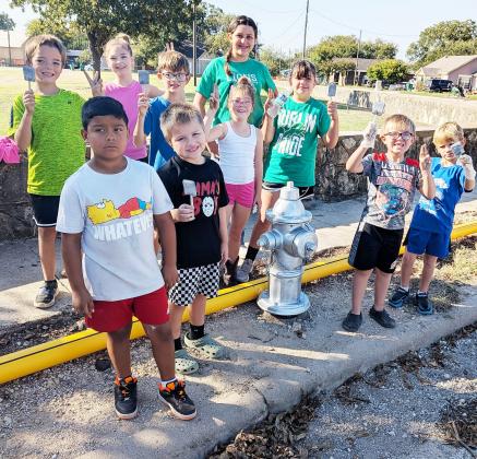 Dublin Cub Scout Pack 35 and 4-H club members gathered Saturday, Oct. 4 and spent the morning painting fire hydrants around town in need of a fresh coat. Higginbotham’s aided the young volunteers by providing the silver paint. Paul Gaudette | Citizen staff photos
