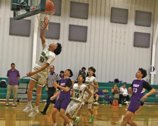 Dublin Freshman Lions drive the ball into the net during a home game against Early Friday, Jan. 16. The home team triumphed over Early 56-22. Paul Gaudette | Citizen staff photo
