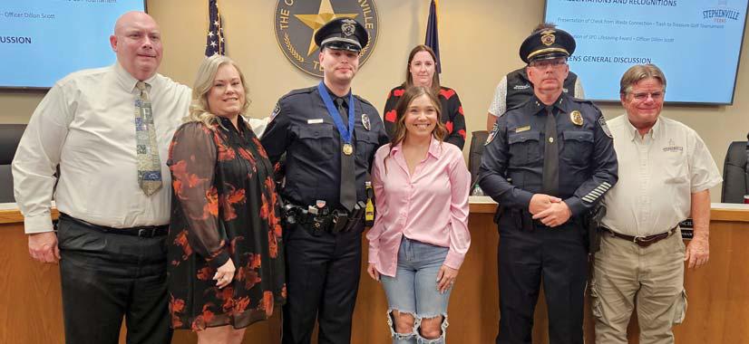 Stephenville Police Officer Dillon Scott was presented the Stephenville PD Lifesaving award after he put himself in harms way to save another human life with dedication and courage. He was congratulated at the Tuesday, Feb. 4 council meeting by Police Chief Dan Harris, Mayor Doug Svien, his wife and parents. Colton Bradberry | Citizen staff photo