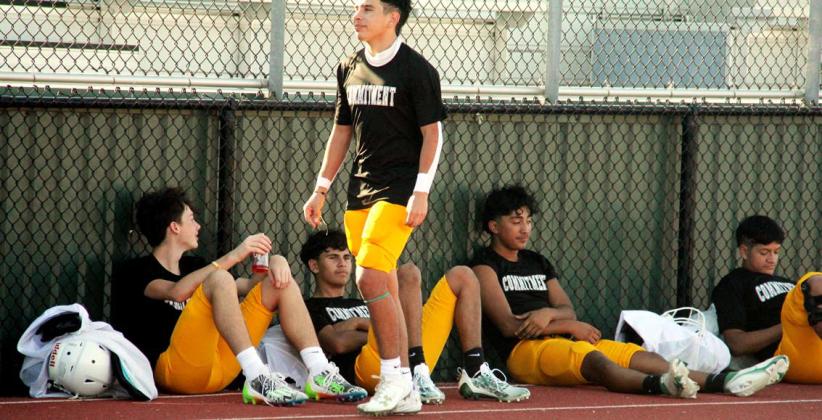 Dublin Varsity Lions find shade (and a Gator!) as they wait for their turn to take the field during the home scrimmages against Hamilton on Friday, Aug. 11. Paul Gaudette | Citizen staff photos