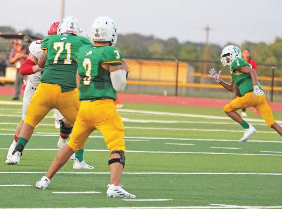 Quarterback Chris Teten checks in with an open Kaden Gaitan for a pass shortly before Gaitan carried it into the Paul Gaudette | Citizen staff photo