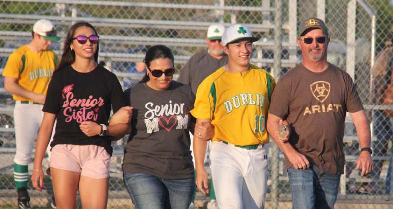 Jacob Arnal (below) sets off on a last lap around the bases alongside head Lions baseball coach Corde Morris. Aiden Salyer (above) walks the bases with his family after the final home game on Tuesday, April 23. Paul Gaudette | Citizen staff photo