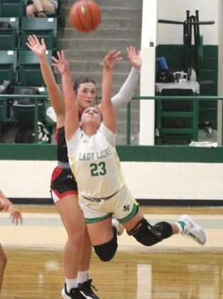Dublin Lions Lady Lion Haden Keilers leaps to keep the ball from an Eastland defender in the Jan. 7 home game. Paul Gaudette | Citizen staff photo