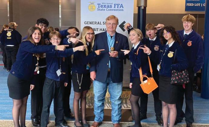 Dublin FFA sponsor Darren Price, center, recently received the Area 4 Golden Owl (or Teacher of the Year) at the State FFA Convention. Price has been in agricultural education for more than 35 years. Submitted photo