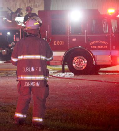 Dublin Assistant Fire Chief John Johnson surveys the scene to check water supply and what is needed as multiple departments battled the blaze at Cutting Edge Cabinets on Hwy. 377 Thursday, Aug. 21. Wyndi Veigel-Gaudette | Citizen staff photo