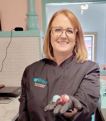 Susan Branham displays handcrafted, painted bonbons for sale at Hot Tempered Chocolates inside Blackjack Office Center. Branham is a world-class chocolatier and Dublin is appreciative of the new business. Wyndi Veigel | Citizen staff photo