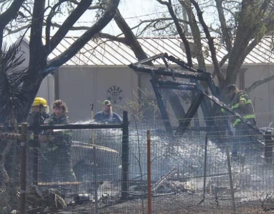Crews work to extinguish a vehicle and shed fire Sunday, March 2 on Pearl Street. The structure and vehicle were a complete loss. Wyndi Veigel-Gaudette | Citizen staff photo