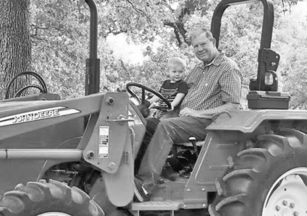 Sammy Gilbert shares a tractor ride