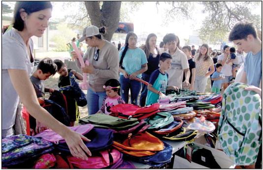 Volunteers helped students pick out free backpacks at the Dublin Public Library’s Back-to-School Fair Saturday, July 29. Though organized by the library, the community comes together each year to make sure students are ready for school and to ease the burden on families financially. Wyndi Veigel I Citizen staff photo